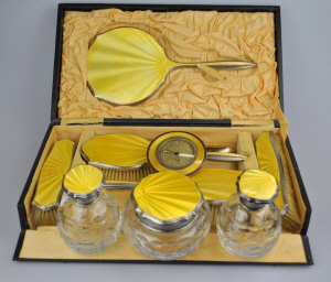 Appraisal: A silver and yellow basse-taille enamel dressing table set comprising