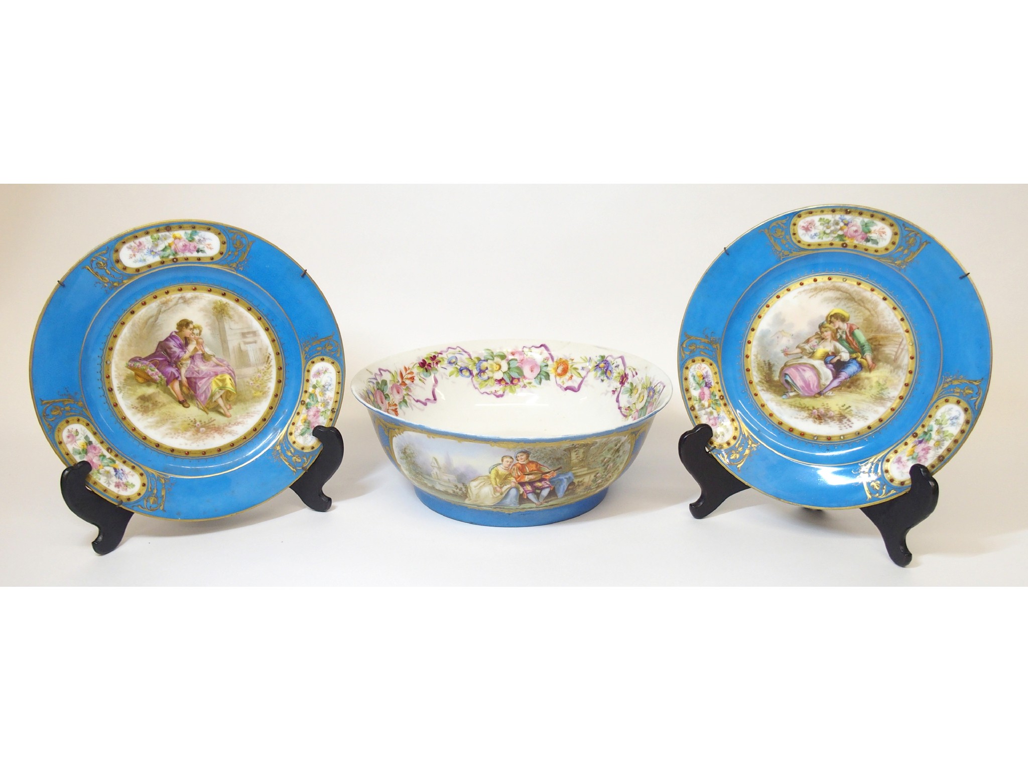 Appraisal: A pair of Sevres-style painted and enamelled porcelain plates and