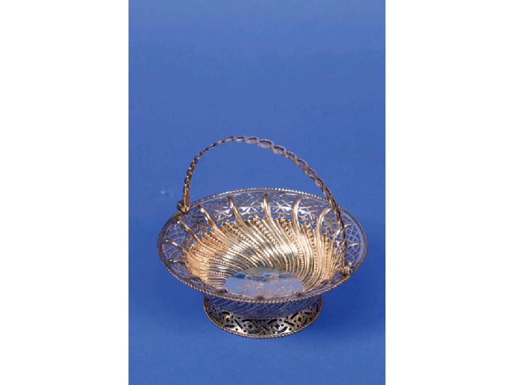 Appraisal: A GEORGE III SWING HANDLE SWEET MEAT BASKET of circular