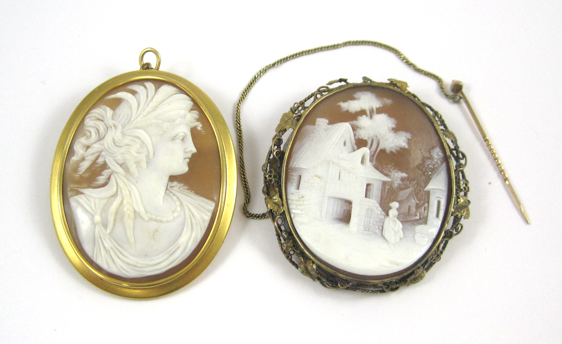 Appraisal: TWO VICTORIAN CAMEO BROOCHES the white on taupe cameo of