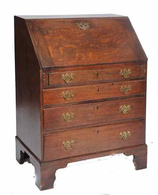 Appraisal: A GEORGE III OAK SMALL BUREAU the interior fitted central