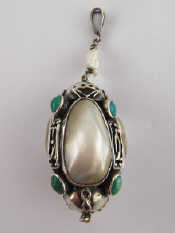 Appraisal: A white metal tests silver pendant set with mother of