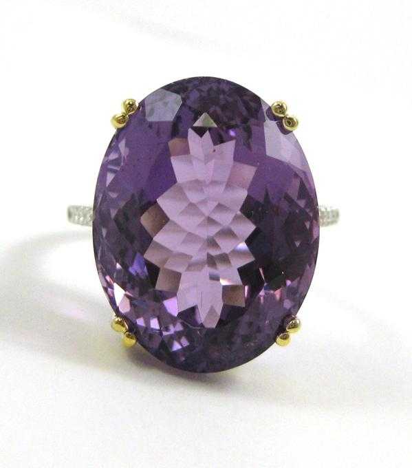 Appraisal: AMETHYST DIAMOND AND FOURTEEN KARAT GOLD RING The white and