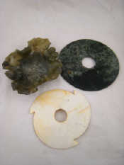 Appraisal: A green hardstone brushwasher formed as a lotus leaf x