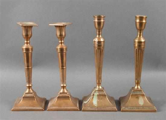 Appraisal: Two pairs of George III brass candlesticks circa square base