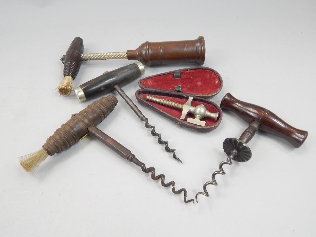 Appraisal: Various corkscrews comprising a brushed topped king rack style example