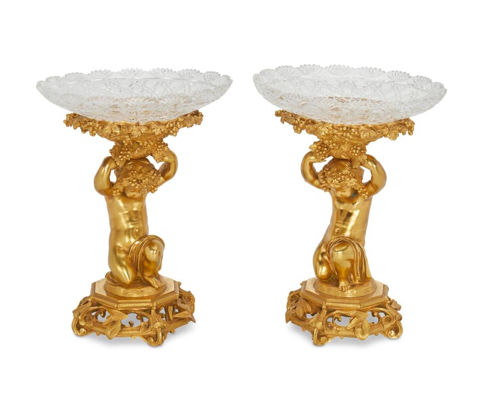 Appraisal: A PAIR OF FRENCH GILT-BRONZE FIGURAL TAZZASA pair of French