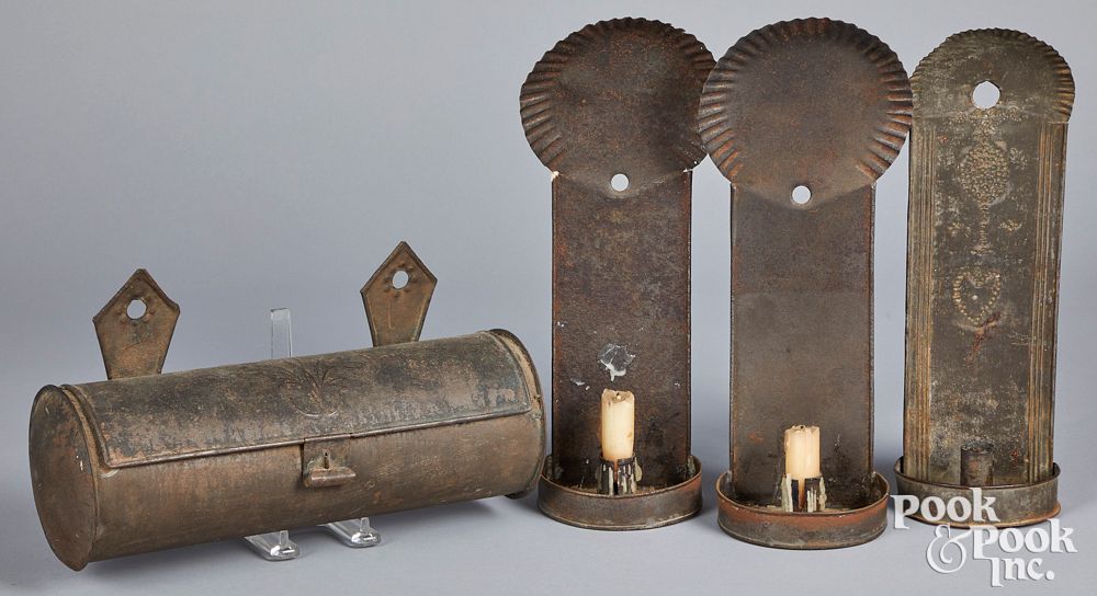 Appraisal: Three tin sconces Three tin sconces th c together with