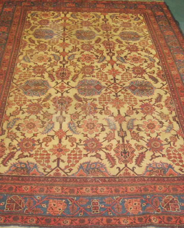 Appraisal: A bordered Ushak Carpet with central field of palmettes on