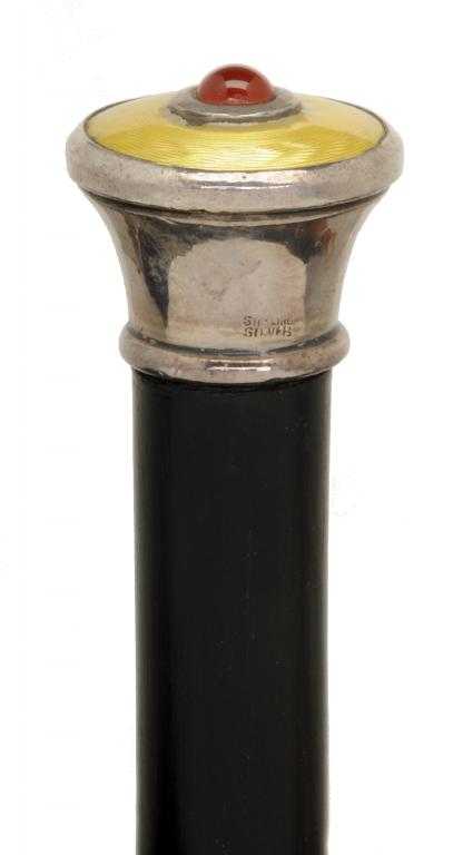 Appraisal: A SILVER-HANDLED EBONY WALKING CANE the flared pommel inset with