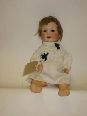 Appraisal: An Armand Marseille bisque head character girl doll with brown