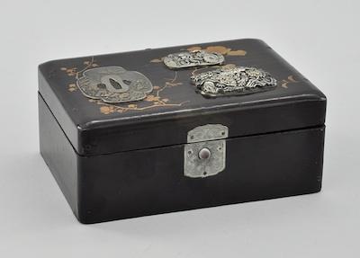 Appraisal: A Japanese Lacquer Box with Applied Metal Ornaments Decorated on