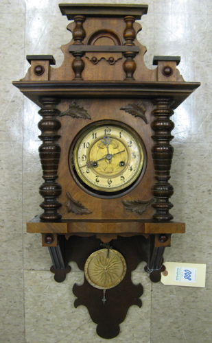 Appraisal: WALNUT PENDULUM BALCONY WALL CLOCK German c the case housing