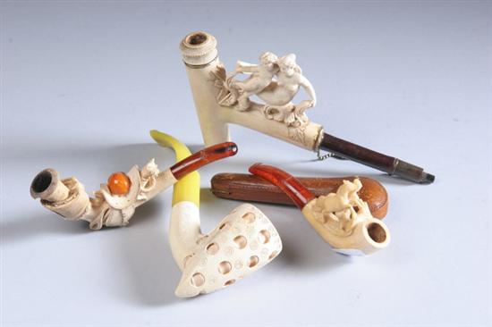 Appraisal: FIVE WHIMSICAL PIPES One with carved and pierced Meerschaum bowl