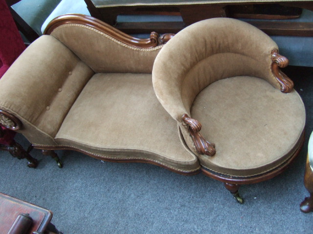 Appraisal: A Victorian walnut and beechwood child's chaise lounge with revolving