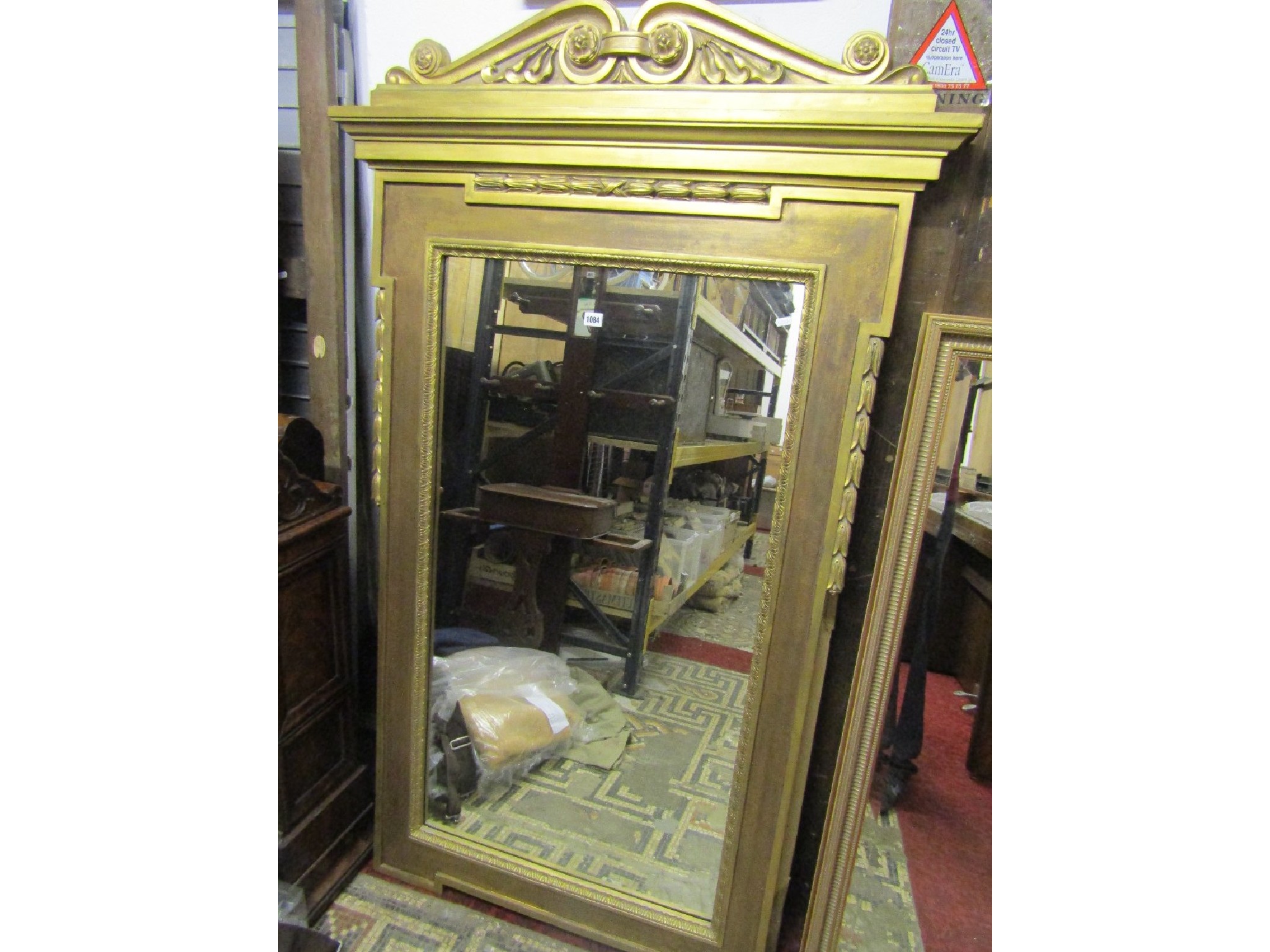 Appraisal: A reproduction gilt framed wall mirror the ogee moulded rectangular