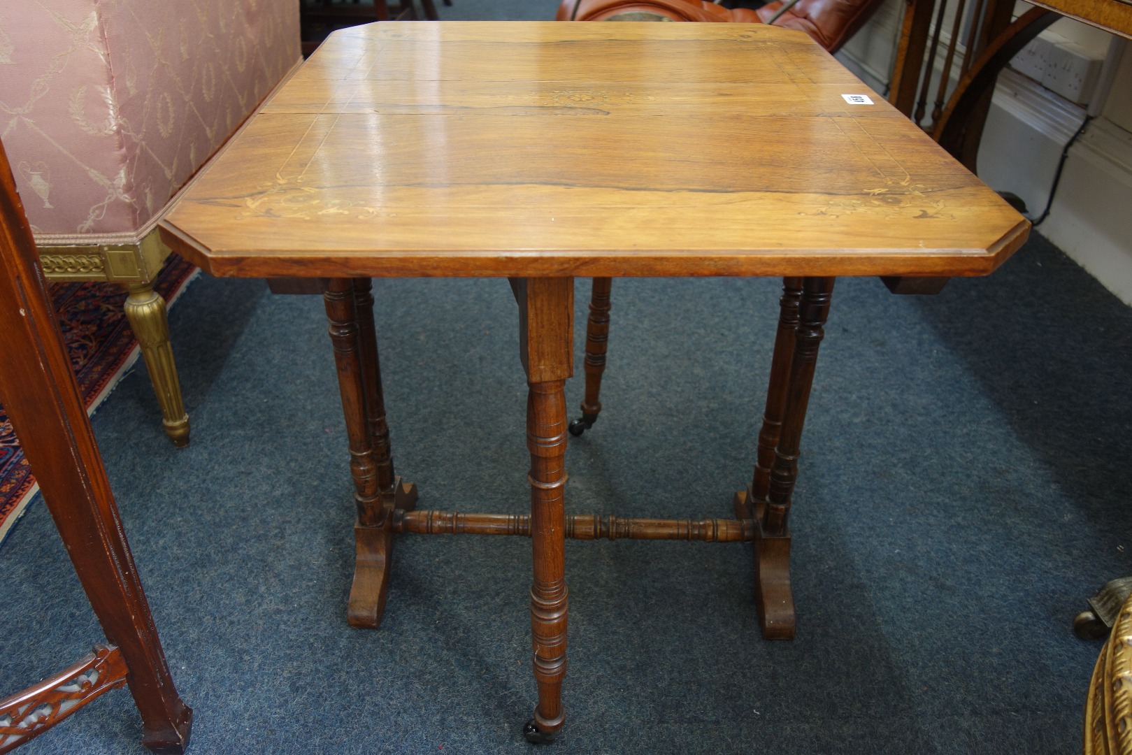 Appraisal: A late Victorian rosewood Sutherland tea table boxwood strung and