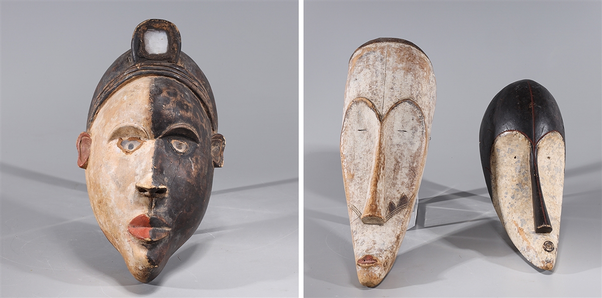 Appraisal: Group of three African tribal masks carved wood with incised