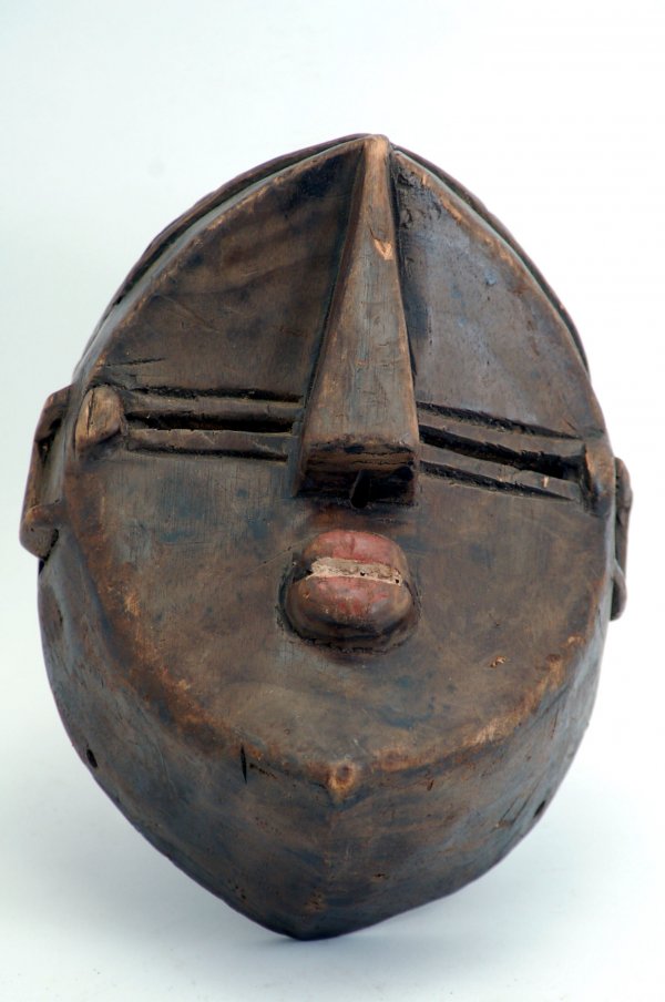 Appraisal: Lwalwa face mask portraying typical geometric abstraction with an enlarged