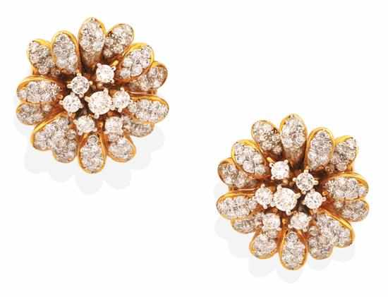 Appraisal: A PAIR OF DIAMOND CLUSTER EARRINGS Of floral design each