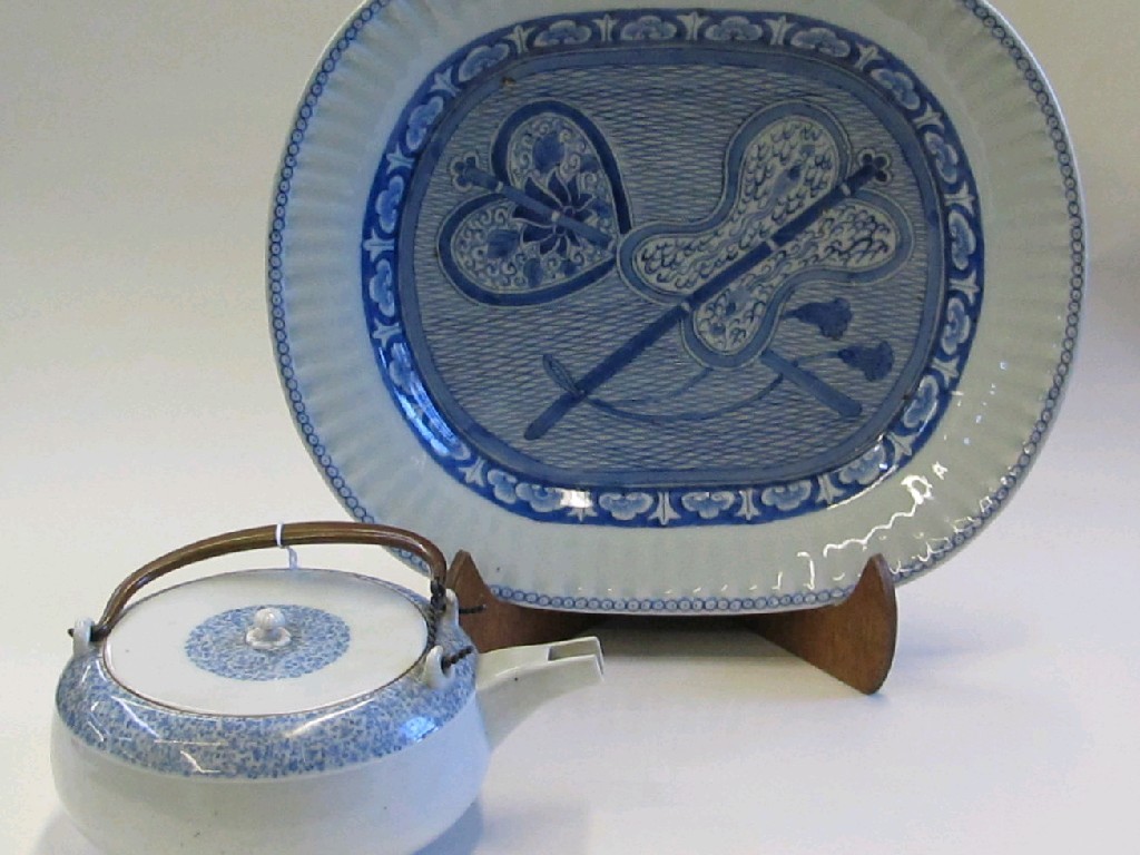 Appraisal: Chinese blue and white oval dish decorated with two fans