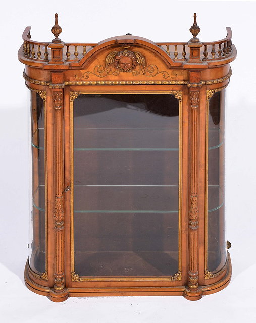 Appraisal: Bird's eye maple and parcel gilt hanging wall cabinetwith interior