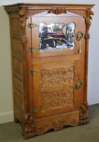 Appraisal: Victorian Carved Oak Mirrored Icebox A rarer model golden oak