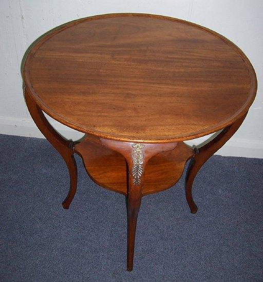 Appraisal: A mahogany and gilt metal mounted table the circular tray