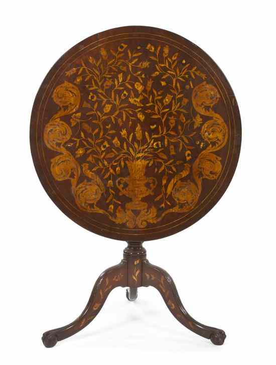 Appraisal: A Continental Marquetry Tea Table having a circular tilt-top with