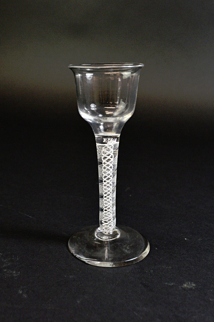 Appraisal: A near pair of opaque twist wine glasses circa each