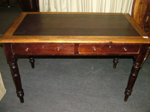 Appraisal: A Victorian mahogany writing table the leather inset top above