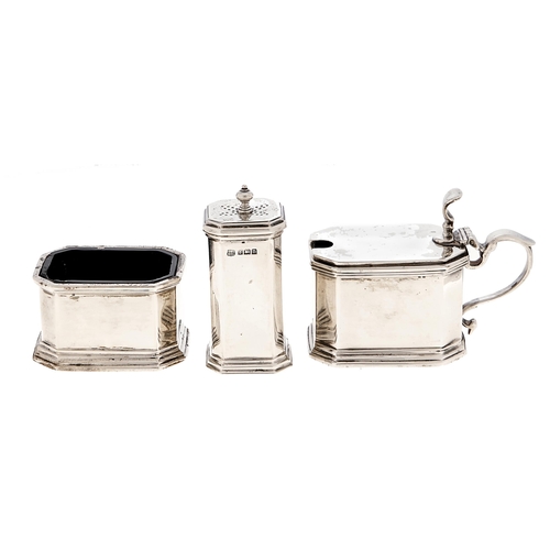 Appraisal: A George V three piece silver condiment set blue glass