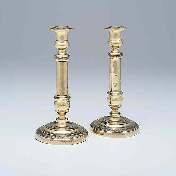 Appraisal: French Brass Candlesticks French th century A pair of brass