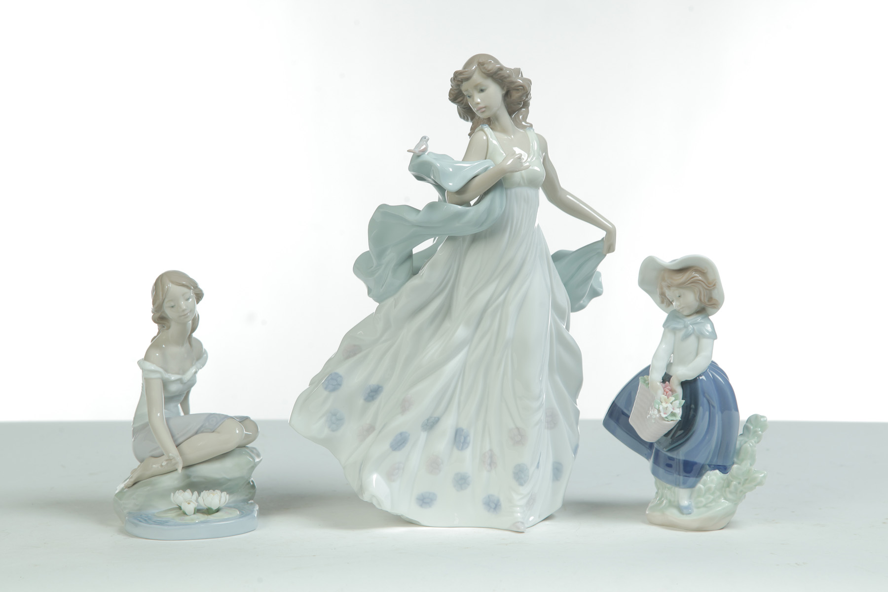 Appraisal: THREE LLADRO FIGURINES Spain th quarter- th century Summer Serenade