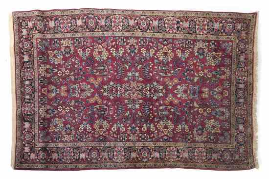 Appraisal: A Sarouk Wool Rug having stylized foliate center medallion on