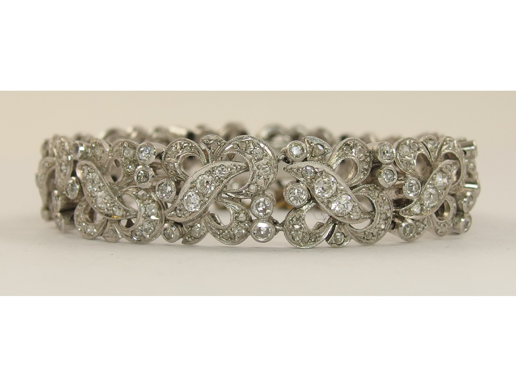 Appraisal: A superb diamond bracelet the white metal panels of abstract