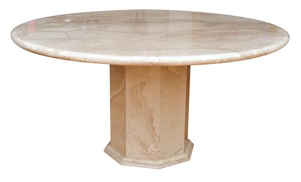 Appraisal: A CIRCULAR TOP TRAVERTINE DINING TABLE WITH A FACETED BASE