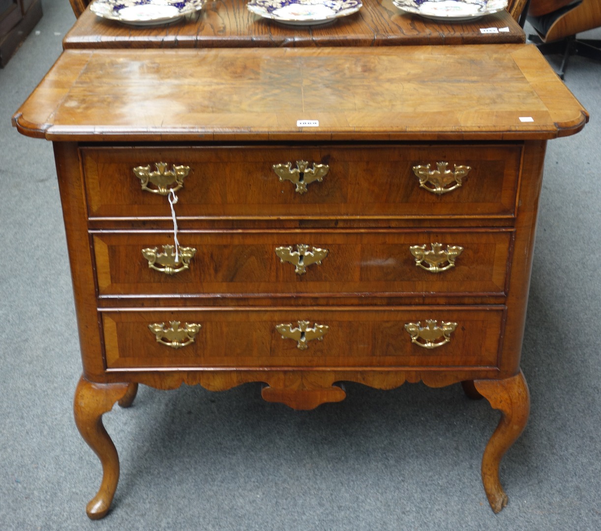 Appraisal: A mid th century figured walnut low boy the three