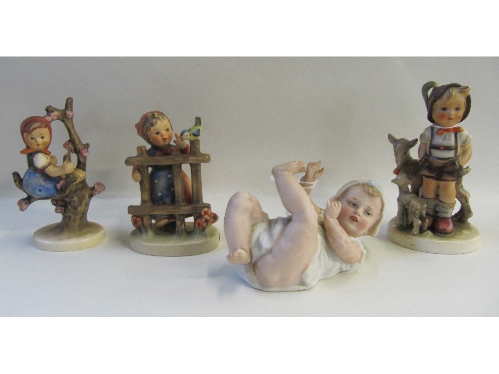 Appraisal: German bisque porcelain piano baby and three Hummel figures including