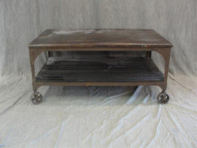 Appraisal: Machine Age Style Iron Wood Wheeled Coffee Table From a