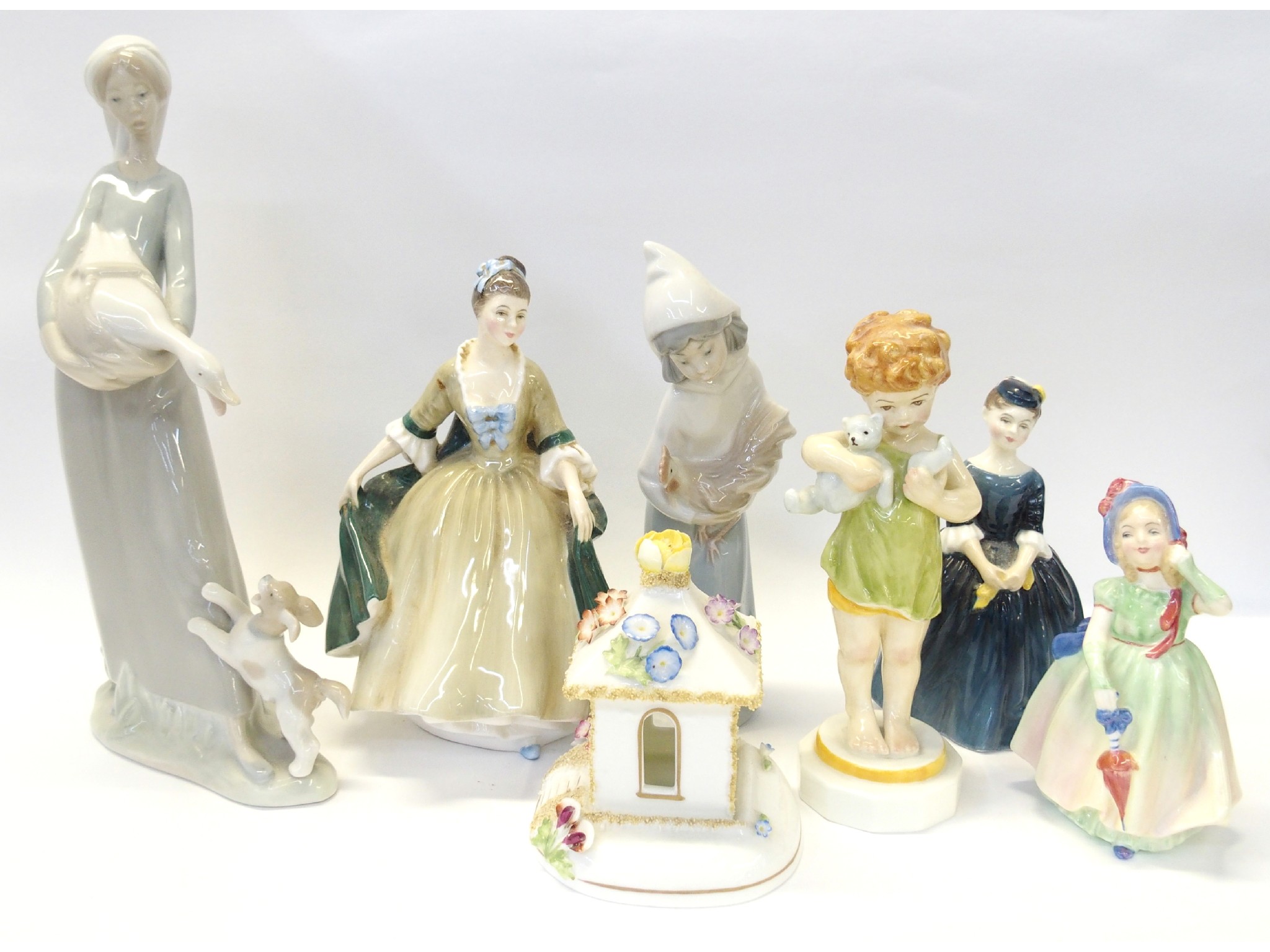 Appraisal: Group of figures comprising Royal Doulton Babie Cherie and Elegance