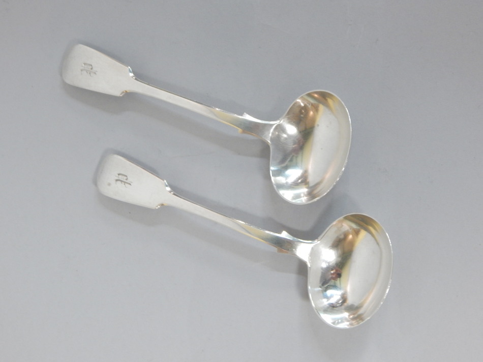 Appraisal: A pair of Victorian silver Fiddle pattern ladles each engraved