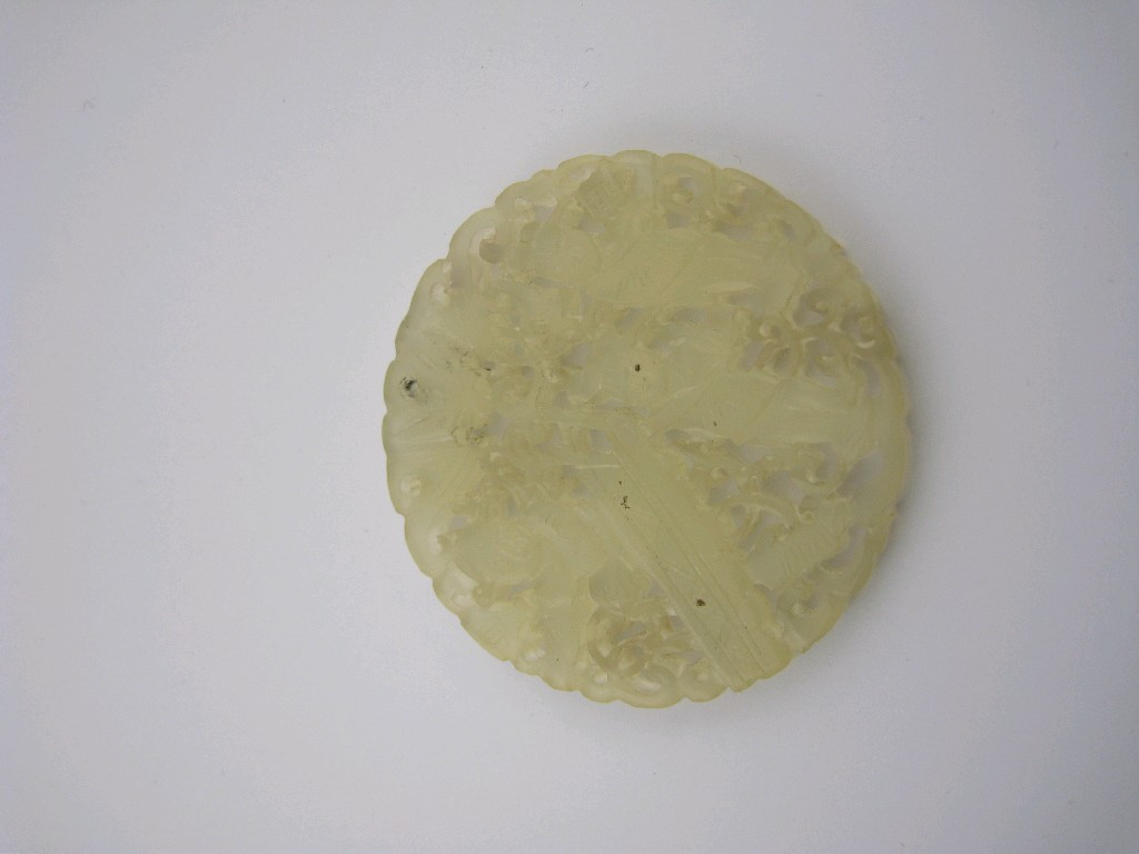 Appraisal: A carved White Jade Disc depicting three Buddahs mm D