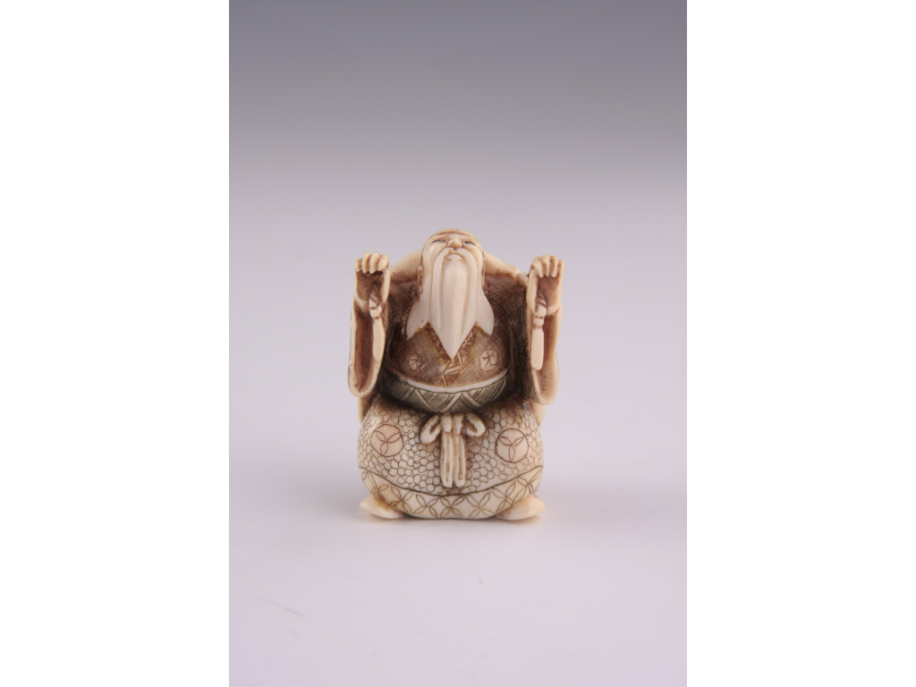 Appraisal: Netsuke Katabori Ivory double image figure cleverly carved to resemble