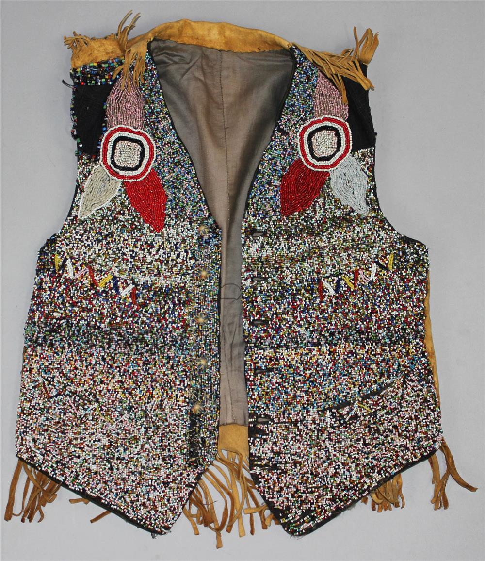 Appraisal: PLATEAU BEADED HIDE MAN'S VEST fully beaded front short fringe