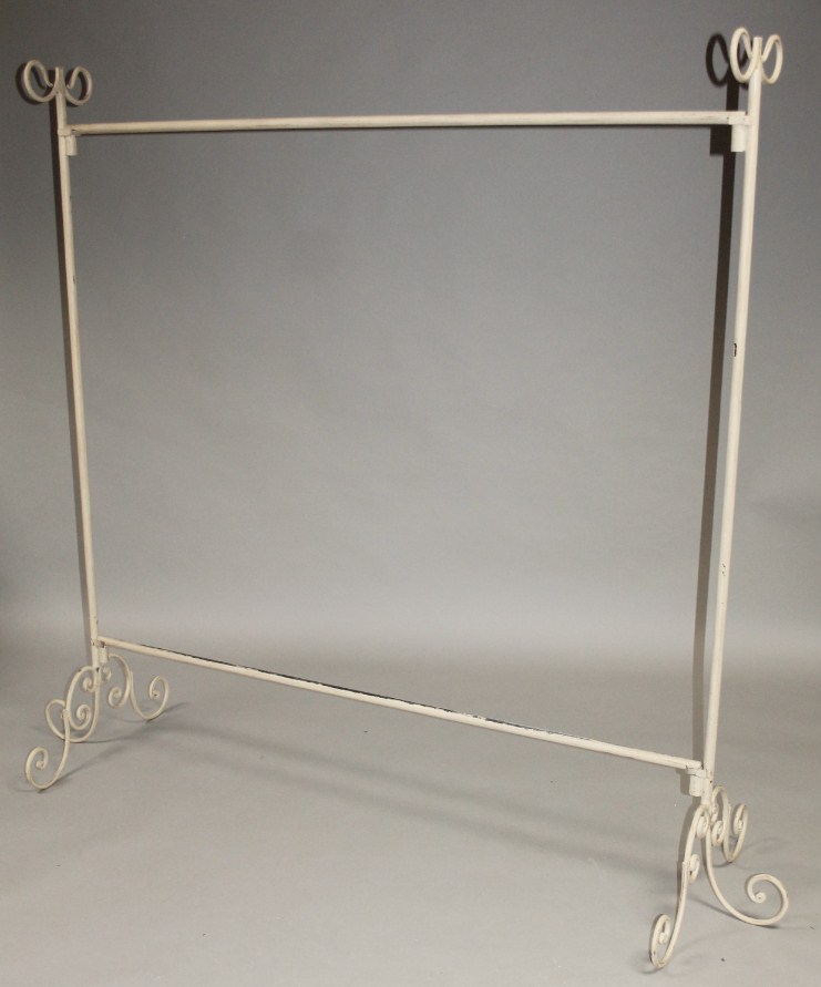 Appraisal: A modern metal framed clothing rail with plain outline and