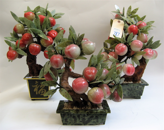 Appraisal: THREE CHINESE HARDSTONE FRUITING JADE TREES having peaches and leaves