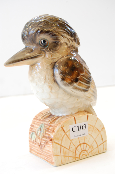 Appraisal: AUSTRALIAN POTTERY KOOKABURRA ON LOG FIGURE