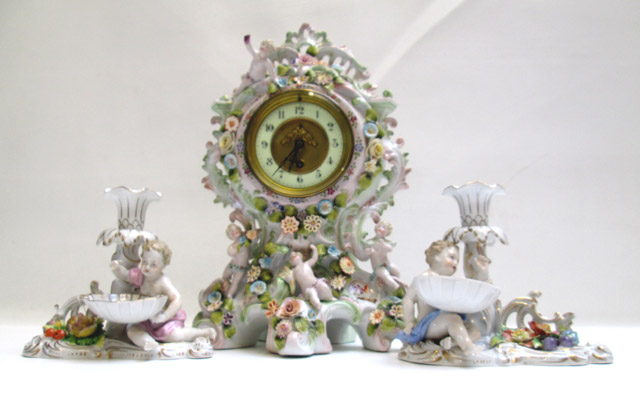 Appraisal: DRESDEN STYLE PORCELAIN CLOCK AND PAIR CANDLESTICKS three pieces the