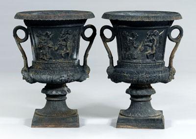 Appraisal: Large pair cast iron garden urns dancing figures in relief